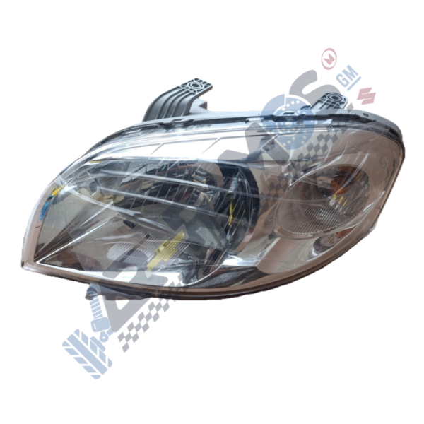 Car headlight assembly with clear lens and reflective housing, viewed from the side.