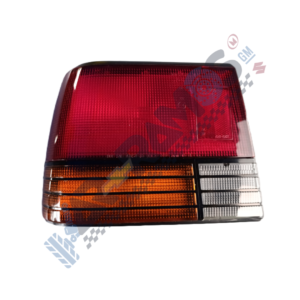 Tail light assembly with red upper lens, orange turn signal strip, and clear lower sections used on a car's rear.
