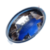 Round blue-tinted car light lens with a chrome rim, photographed at an angle.