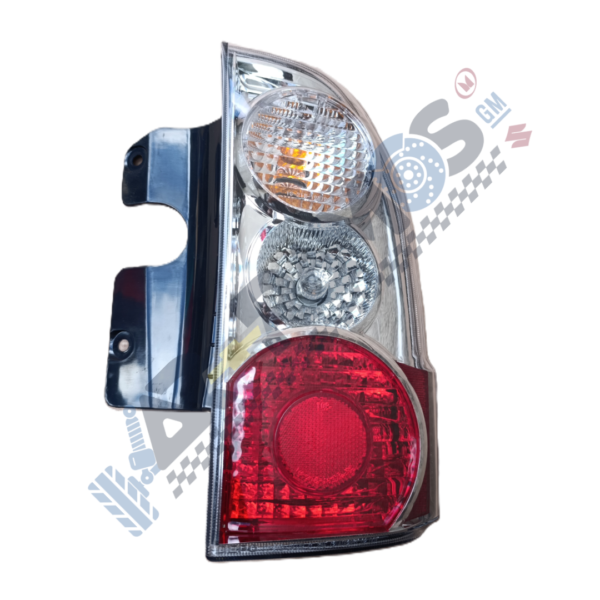 Tail light assembly with red taillamp at bottom and clear indicators on top, mounted on a black bracket/top edge visible on left.