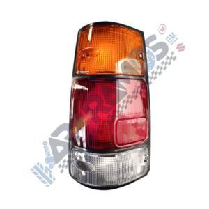 Vertical car tail light cluster with orange indicator at top, red brake light in middle, and clear reverse light at bottom.