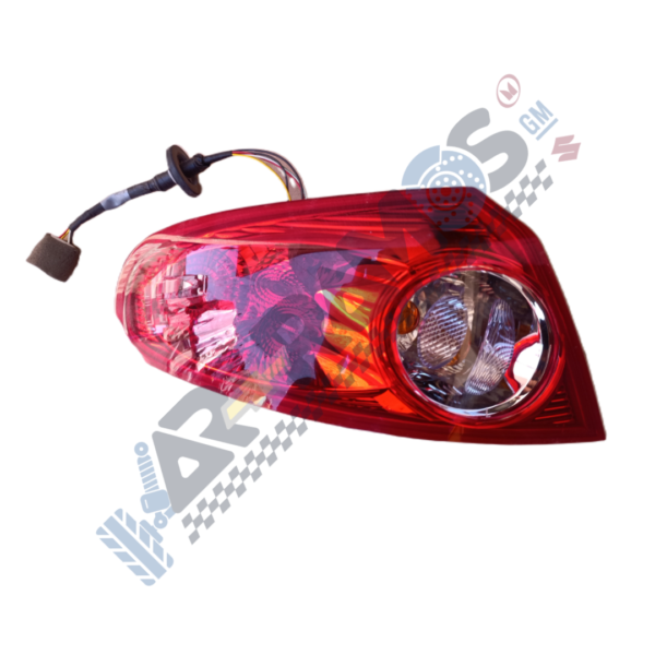 Red automotive tail light assembly with exposed wiring harness, isolated on white background