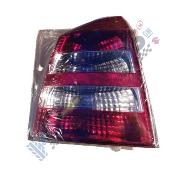 Tail light assembly for a car with red, clear, and amber sections, wrapped in protective plastic