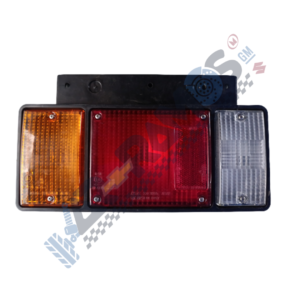 Three-section vehicle tail light: amber left indicator, red center brake light, and clear right reverse light.