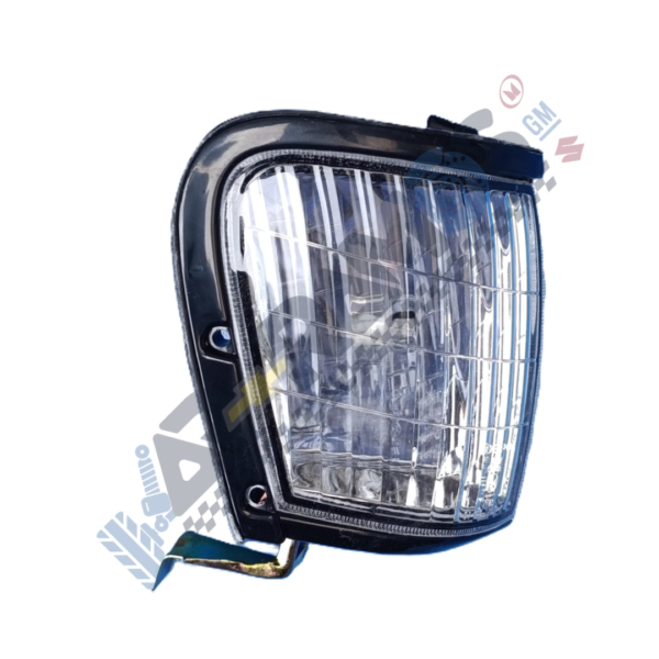 Designer - Autorepuestos Ramos Rectangular automotive headlight with a clear lens and metal mounting tab/breakaway bracket.