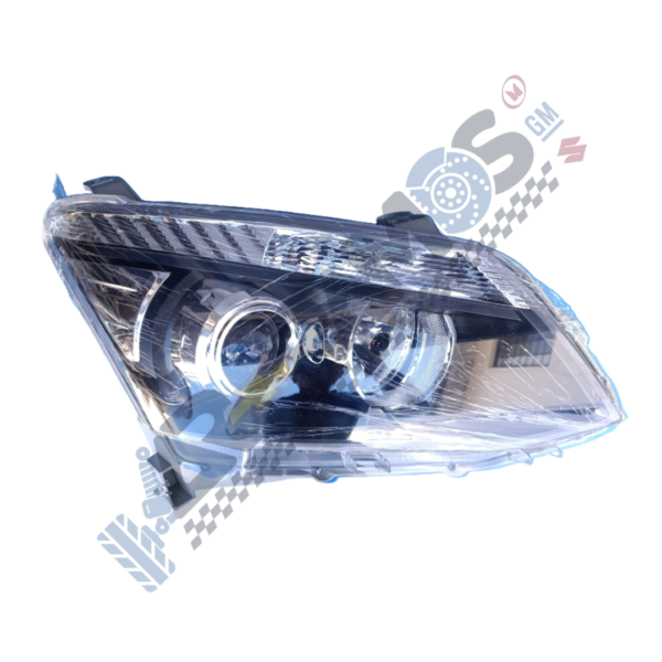 Headlight assembly for a car with projector lens and chrome interior, viewed from the side.